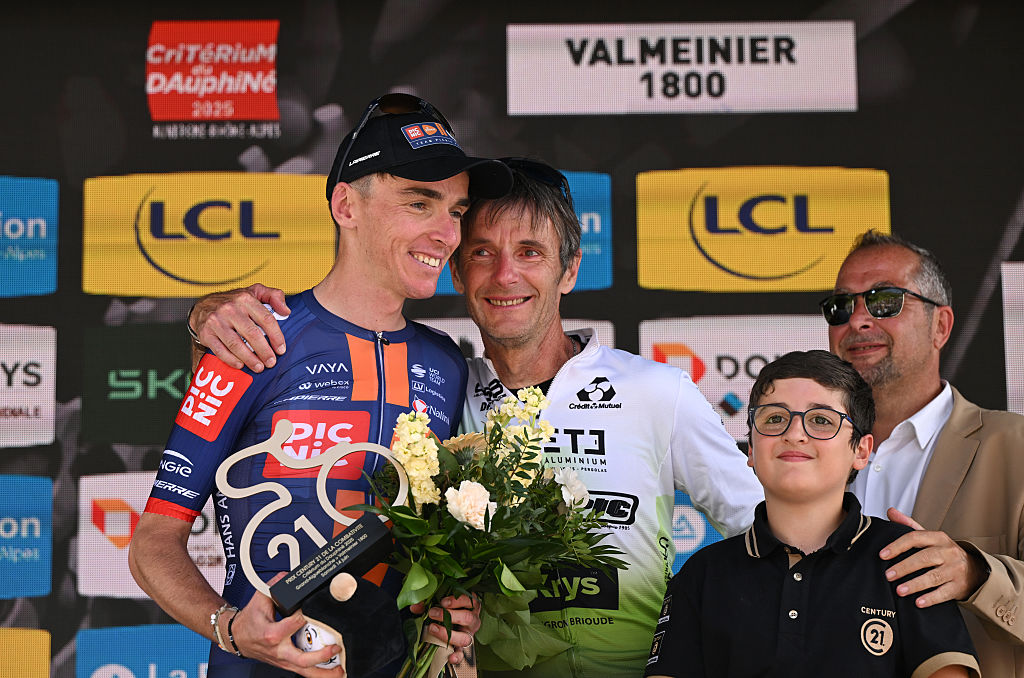 VALMEINIER 1800, FRANCE - JUNE 14: Romain Bardet of France and Team Picnic PostNL celebrates at podium as most combative rider prize winner with his father Philippe Bardet during the 77th Criterium du Dauphine 2025, Stage 7 a 131.6km stage from Grand-Algueblanche to Valmeinier 1800 (1830m) / #UCIWT / on June 14, 2025 in Valmeinier 1800, France.