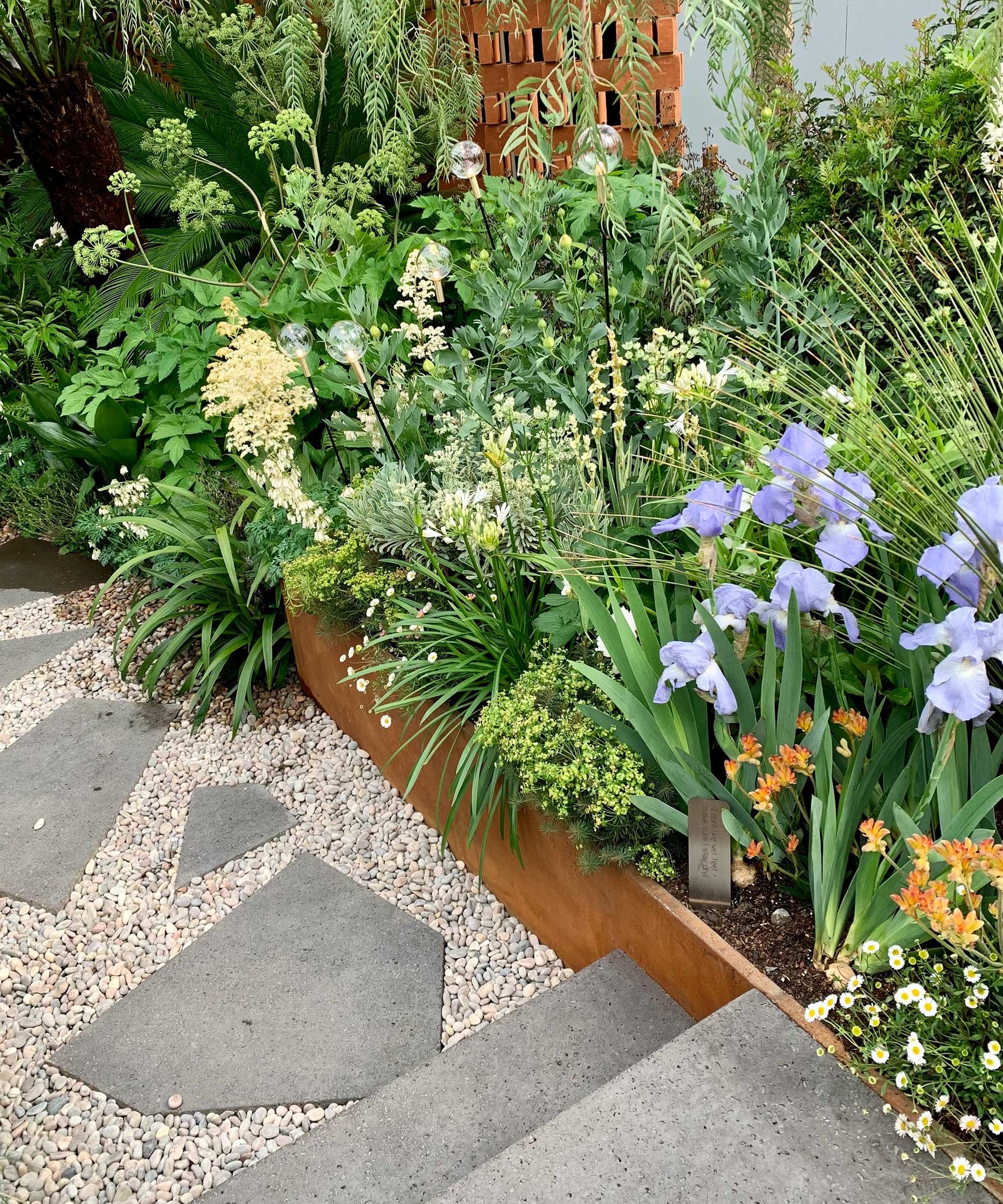 path with lighting and paving in Kate Gould design