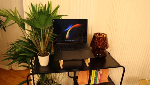 Samsung Galaxy Book3 on a wooden stand