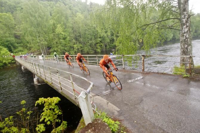 CCC Polsat crossing a bridge over a rising river