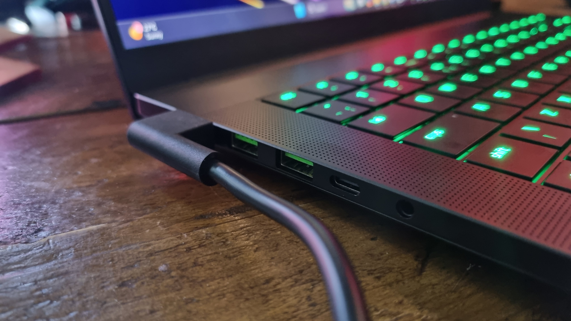 The left hand side of the Razer Blade 16 2026 gaming laptop, showing the USB ports and power cable