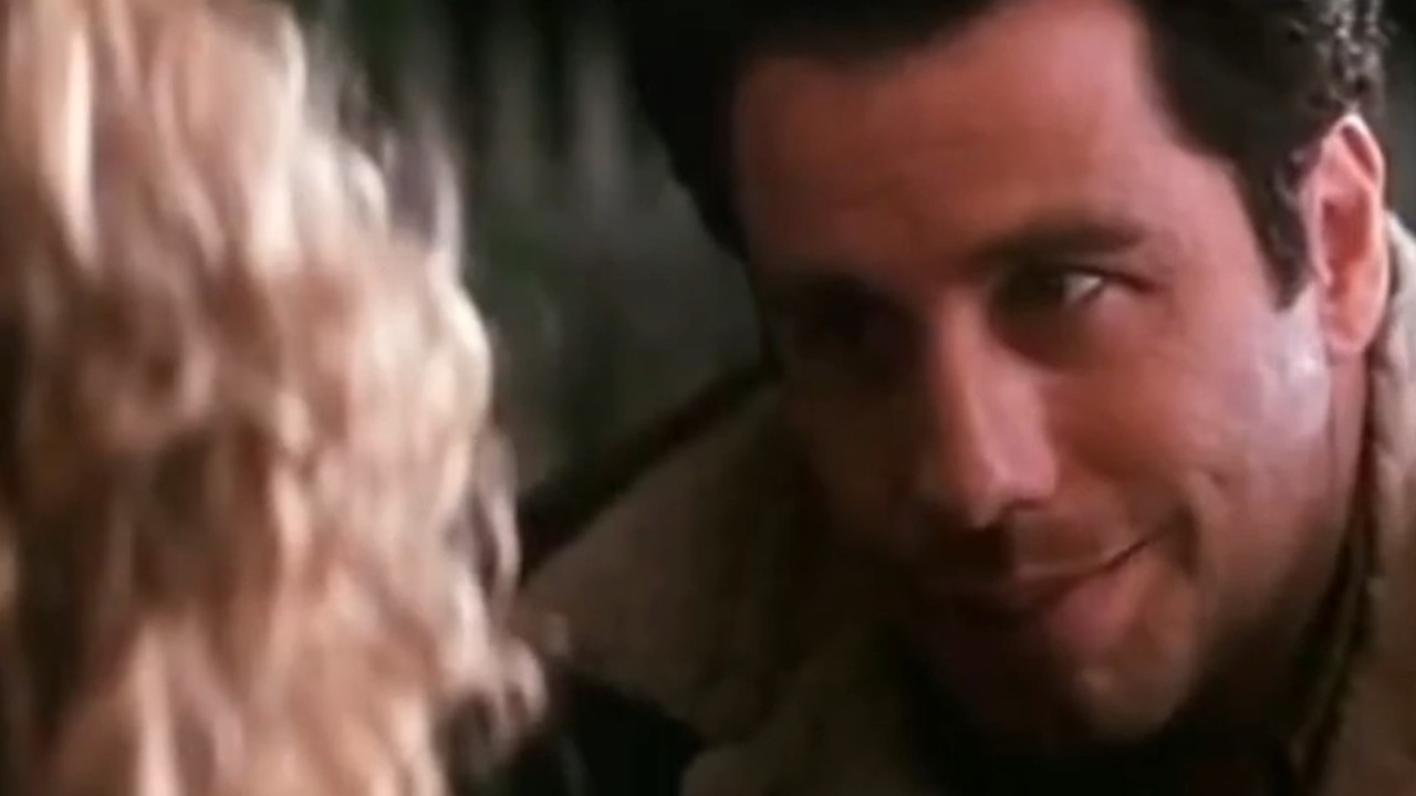 Johnn Travolta talking to a woman in Phenomenon