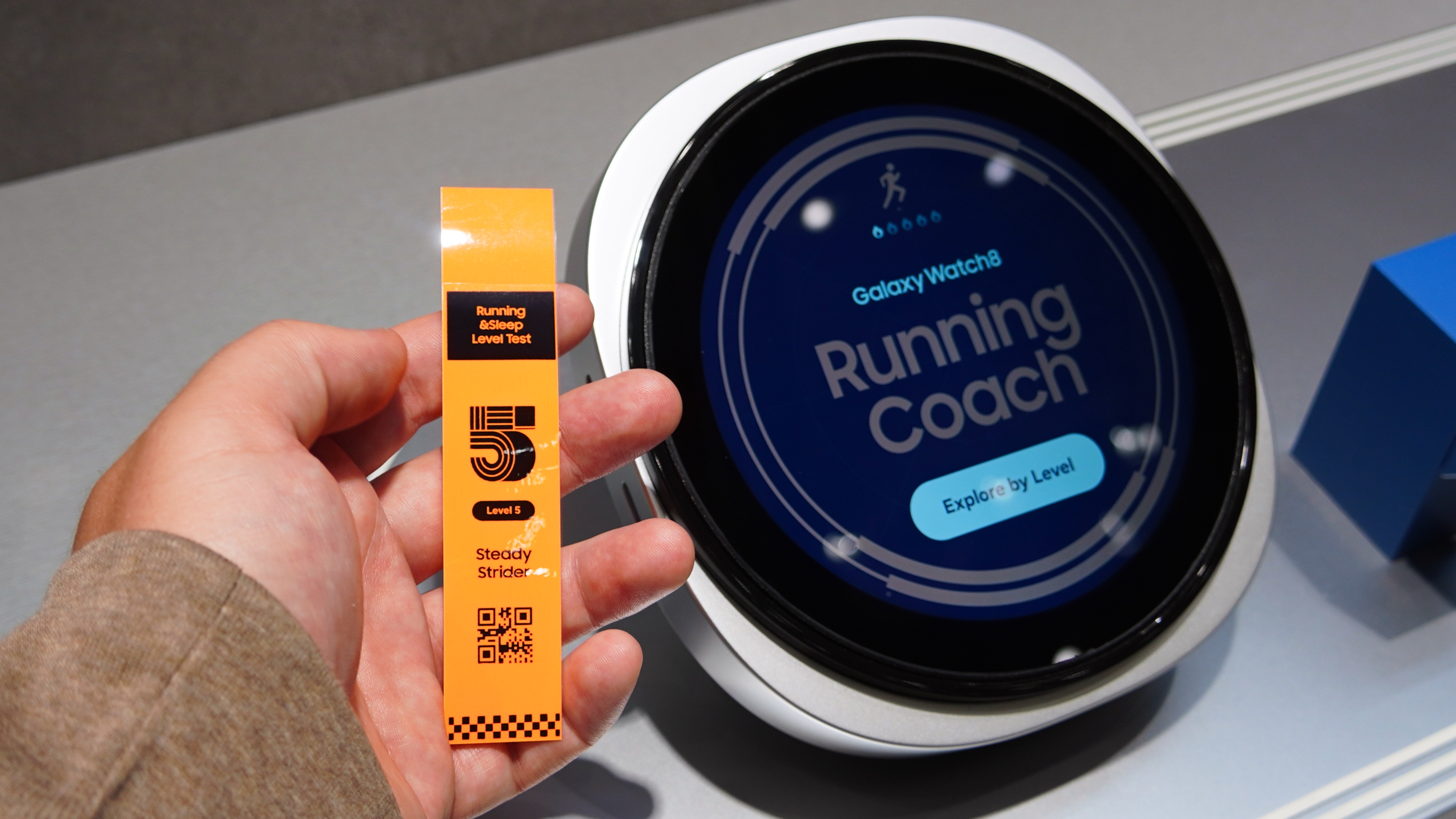 A supersized Galaxy Watch 8 showing off Running Coach at IFA 2025.
