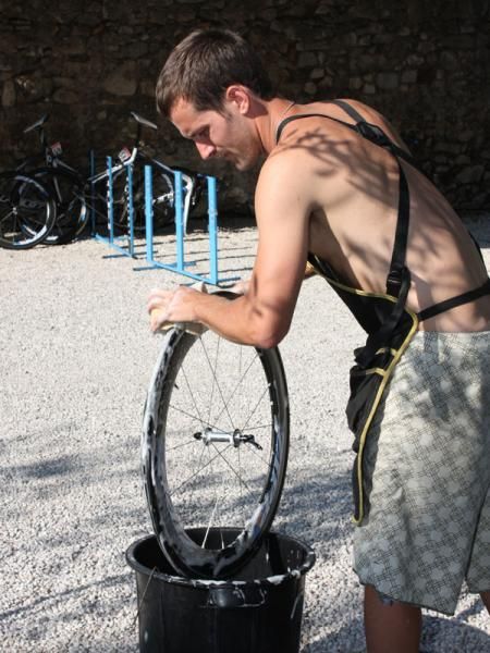 Wheels and tires are carefully scrubbed so they can be inspected for cracks and cuts.