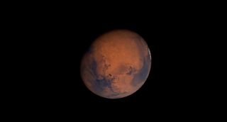 An illustration of Mars as it will appear in the April 2023 night sky.