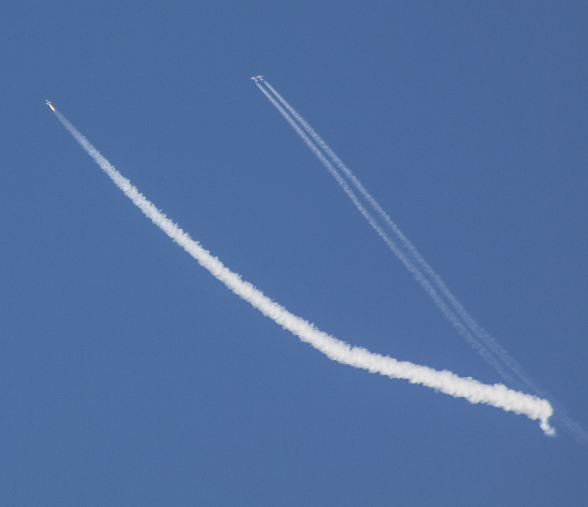 Virgin Galactic&#039;s SpaceShipTwo rises into the sky on a pillar of flame on Sept. 5, 2013 during its second-ever rocket-powered flight test. At right is WhiteKnightTwo, the private space plane&#039;s mothership, which carried it into the sky.