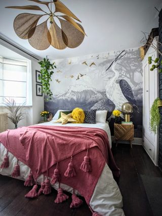 Crane bedroom mural frames upholstered bed with hot pink bedding and yellow detail