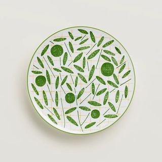 white plate with green leaf pattern