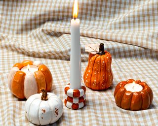 Five clay pumpkin candle holders using Sculpt limited edition Halloween pottery kit.