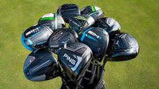A selection of TGW golf clubs in a golf club bag.