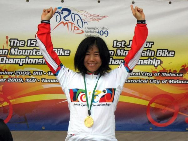 Mio Suemasa (Japan) celebrates her victory in the elite women's downhill.
