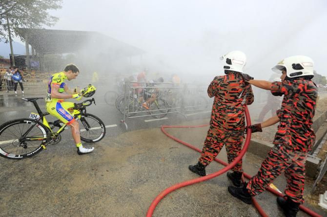 The riders get a spray down at the finish