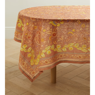 orange tablecloth with yellow floral pattern