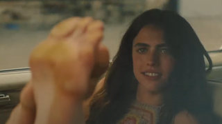 Margaret Qualley puts her feet on the windshield during a scene in Once Upon A Time In Hollywood.