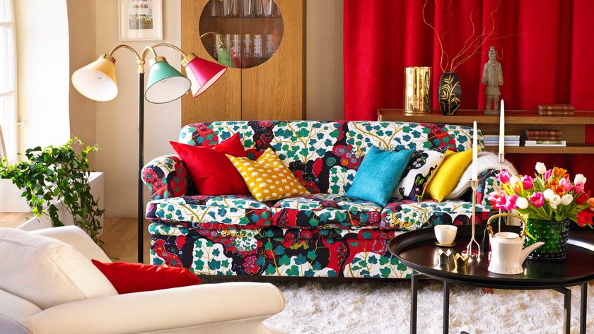 Dopamine decor, a living room with bright patterned sofa and red curtains