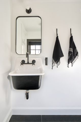 a modern powder room in a farmhouse style