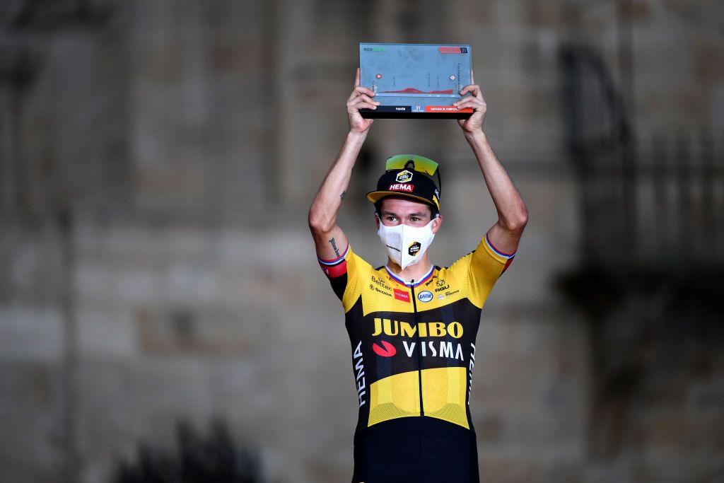 SANTIAGO DE COMPOSTELA SPAIN SEPTEMBER 05 Primoz Roglic of Slovenia and Team Jumbo Visma celebrates winning the stage on the podium ceremony after the 76th Tour of Spain 2021 Stage 21 a 338 km Individual Time Trial stage from Padrn to Santiago de Compostela lavuelta LaVuelta21 ITT on September 05 2021 in Santiago de Compostela Spain Photo by Tim de WaeleGetty Images