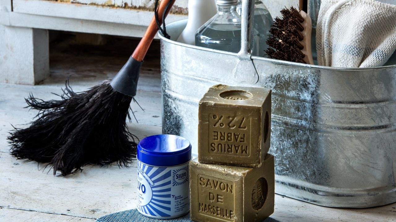 A bucket with cleaning products and tools