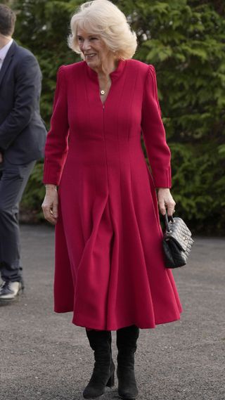 Queen Camilla in a classic red dress