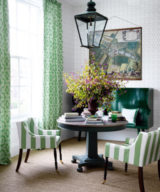 green stripe upholstered dining chairs, round pedestal table, green settle bench, lantern pendant