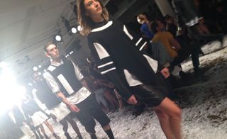 Models on the runway wearing black and white clothing