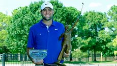 Scottie Scheffler holds the Korn Ferry Tour Player of the Year award