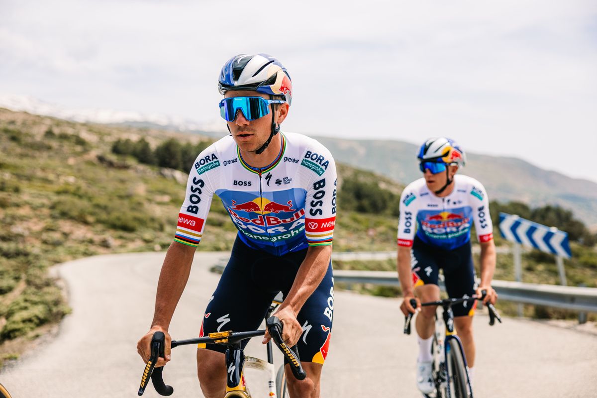 Red Bull Bora Hansgrohe kit for the 2026 Tour de France, featuring a blue gradient on a white jersey with black shorts