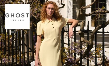 Woman posing in Ghost London's yellow dress