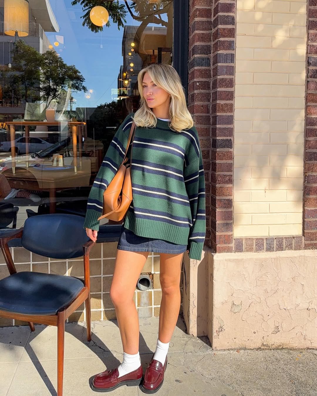 Jamie Lyn wearing the Reformation Cove in Stripe