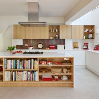 white kitchen with wooden cupboards and island with undercounter storage