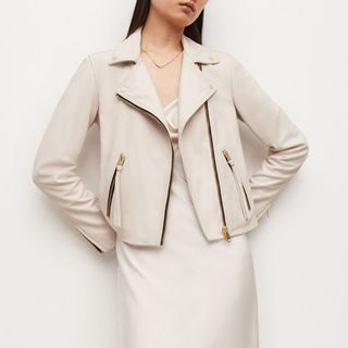 model wearing white all saints dalby leather jacket