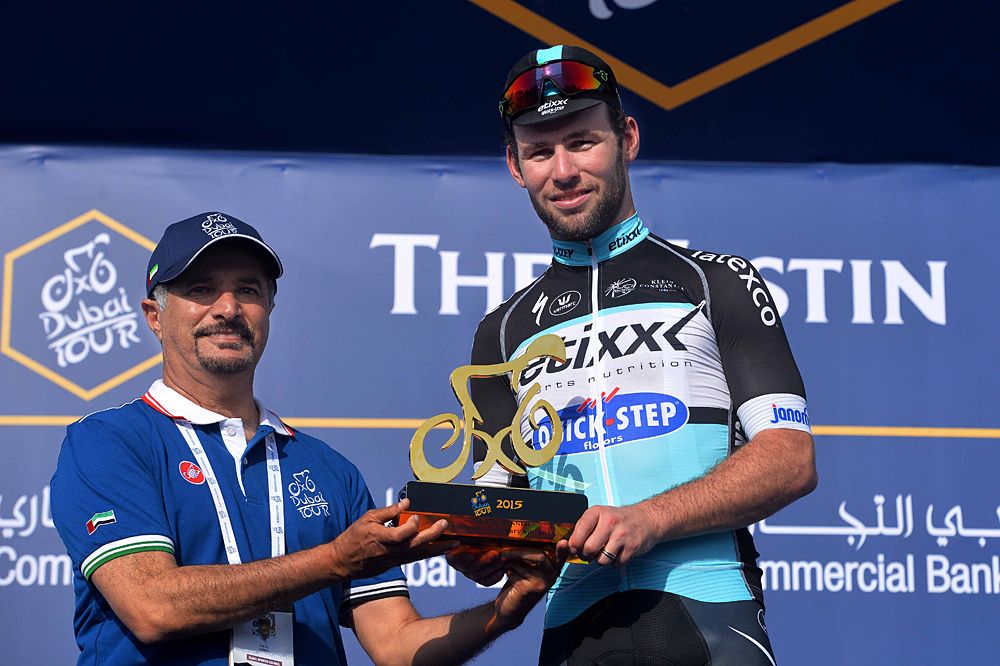 Mark Cavendish (Etixx-QuickStep) is awarded a cycling trophy