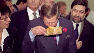 King Charles visits the market in Ljubljana, Slovenia and smells a box of wild mushrooms