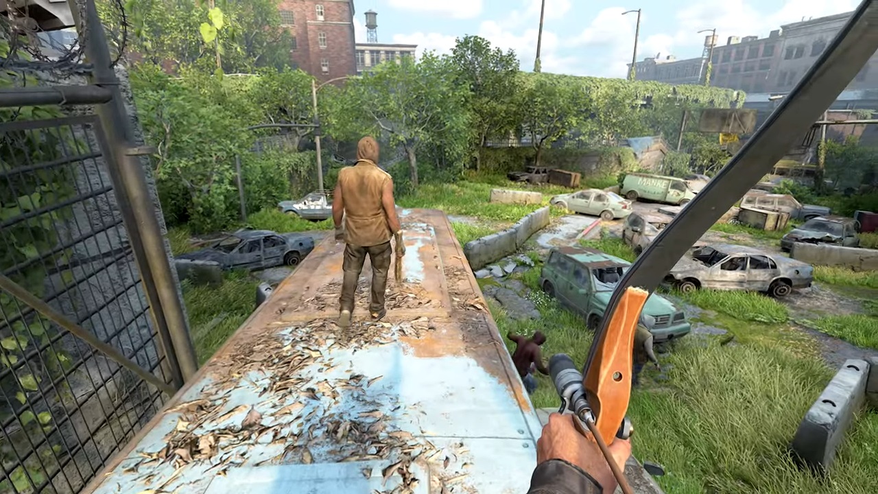 first person view sneaking up on survivor on top of abandoned school bus overlooking parking lot