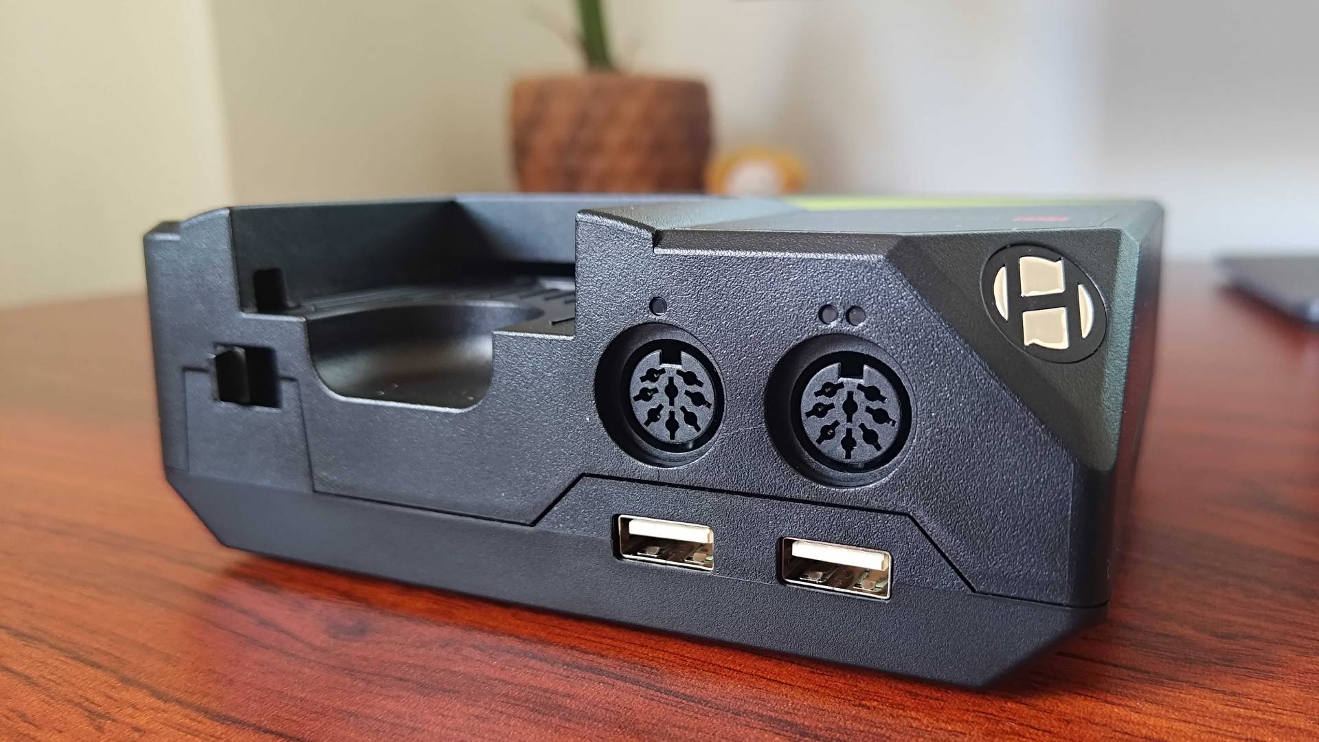 Close up of Hyperkin Retron GX controller ports on woodgrain desk.
