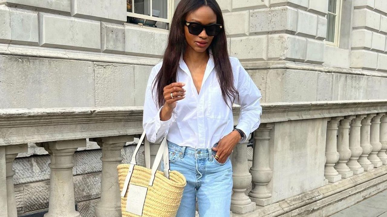 Instagram photo of @symphonyofsilk Lorna posing in black sungless, white button-up, jeans, and basket tote