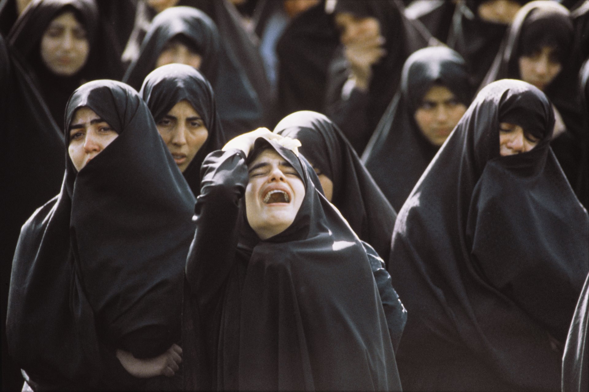 "01 January, 1989 Chaos reigns the streets at the funeral procession for the Ayatollah Khomeini, who died at the age of 89. Among the millions of mourners giving free reign to their grief, several people were crushed to death; many more fainted and suffered injuries."