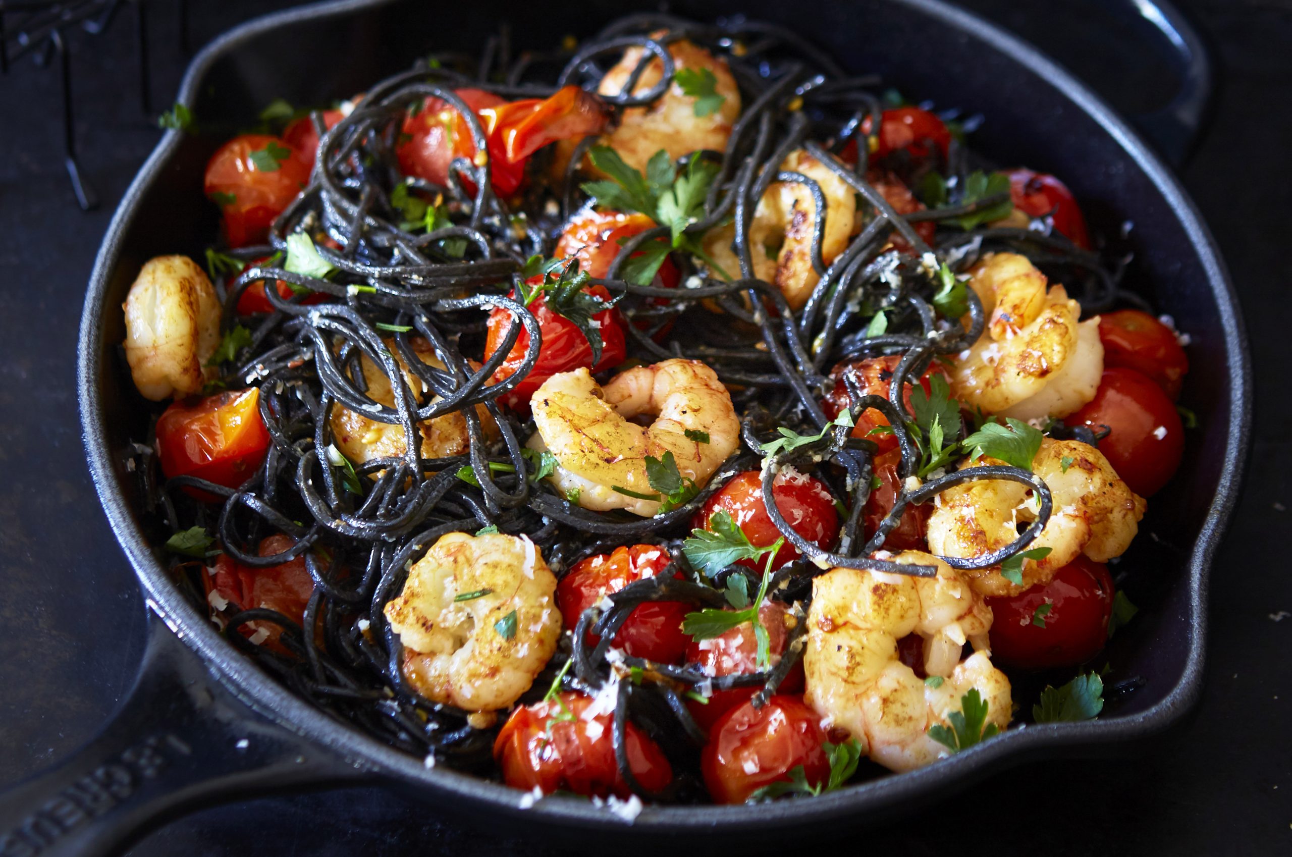 Black Pasta With Cherry Tomatoes And Prawns | Dinner Recipes | Goodto