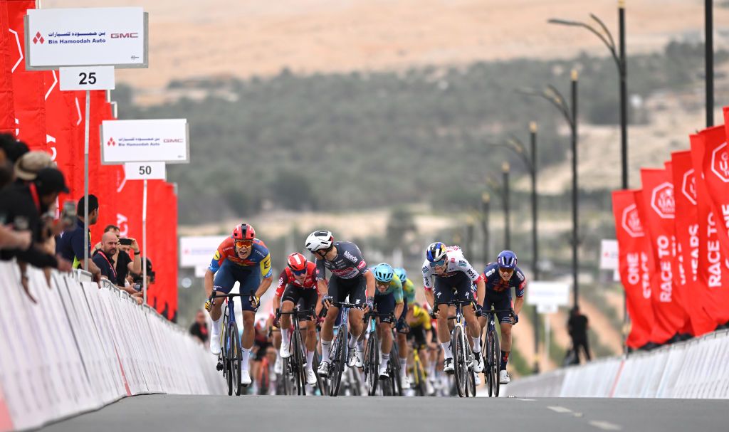 LIWA PALACE ABU DHABI UNITED ARAB EMIRATES FEBRUARY 17 LR Stage winner Jonathan Milan of Italy and Team LidlTrek Jasper Philipsen of Belgium and Team AlpecinDeceuninck Finn Lachlan Fox FisherBlack of New Zealand and Team Red Bull Bora Hansgrohe and Edgar Oscar Onley of The United Kingdom and Team Picnic PostNL sprint at finish line during the to the 7th UAE Tour Stage 1 a 138km stage from Madinat Zayed Shams Solar Park to Liwa Palace UCIWWT on February 17 2025 in Liwa Palace Abu Dhabi United Arab Emirates Photo by Dario BelingheriGetty Images
