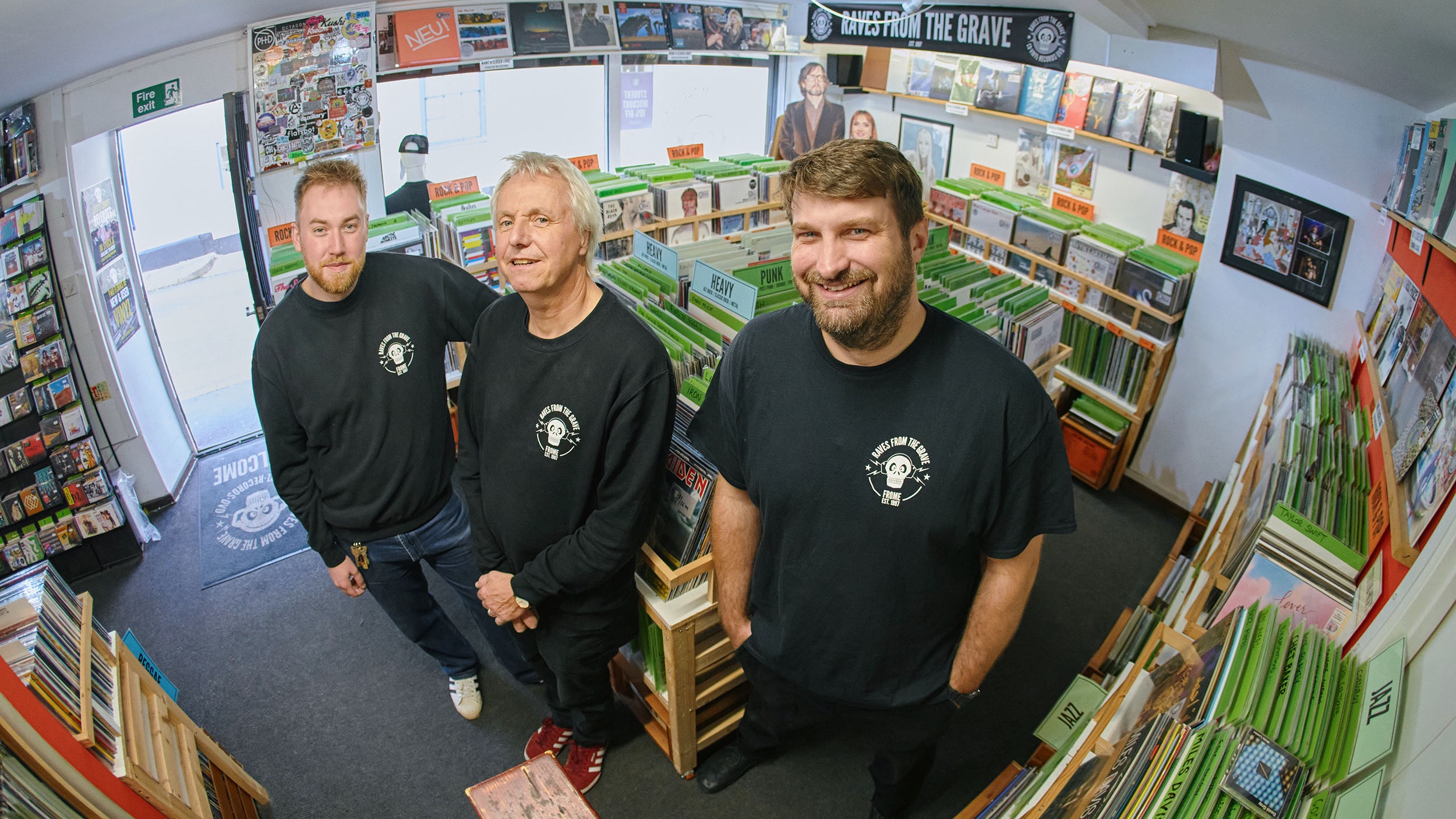 Three staff members in Frome's Raves From The Grave record shop.