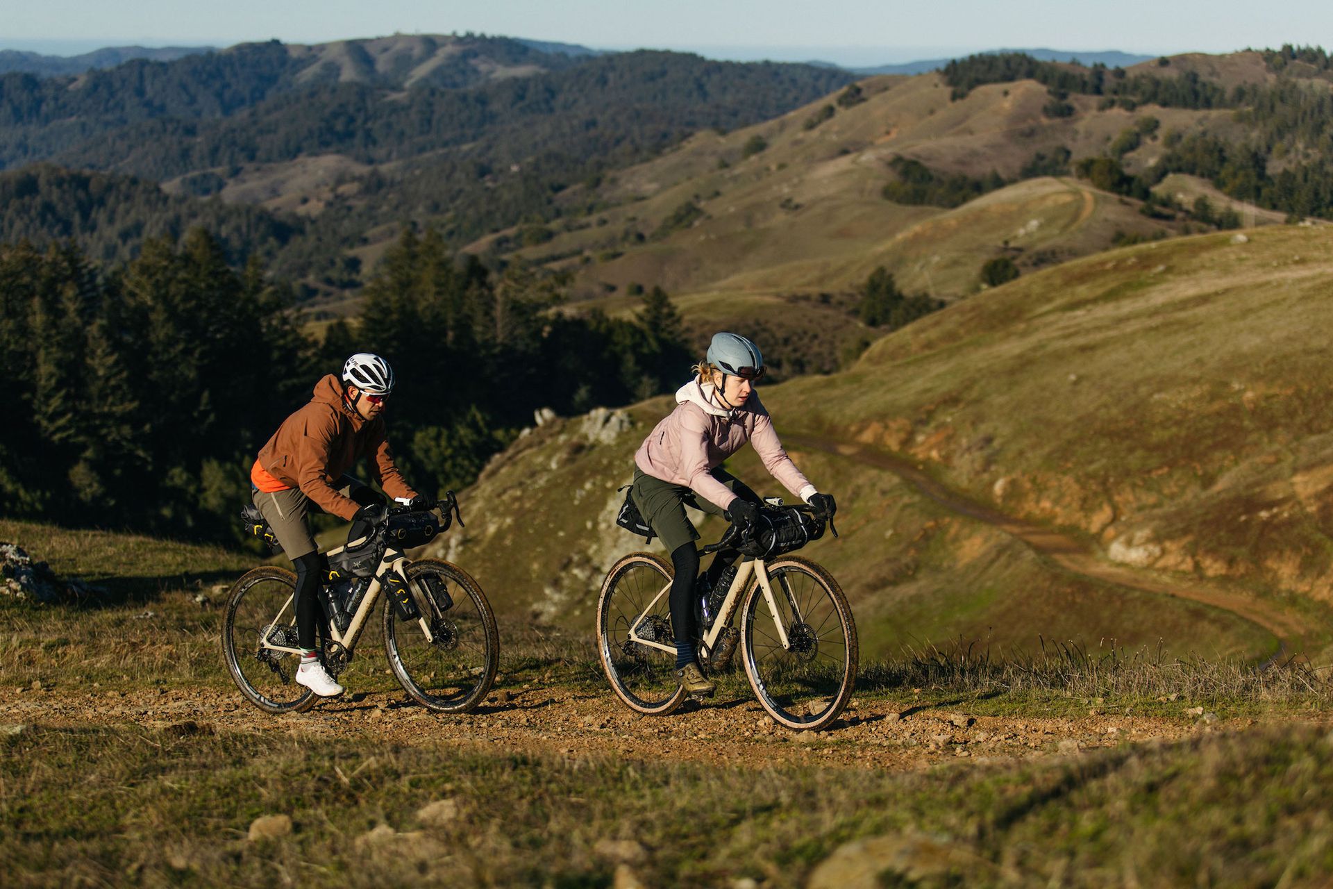 Two cyclists riding the Enve MOG on a hilly off-road route