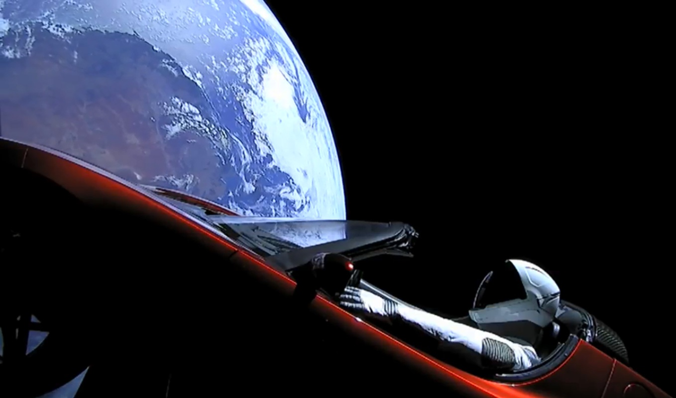 A camera shows SpaceX&#039;s Starman mannequin and Elon Musk&#039;s Tesla Roadster as they fly above a ROUND Earth after launching on the first Falcon Heavy rocket test flight on Feb. 6, 2018.