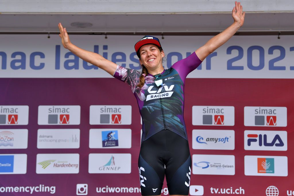 HARDENBERG NETHERLANDS AUGUST 25 Alison Jackson of Canada and Team Liv Racing celebrates winning the Yellow Leader Jersey on the podium ceremony after the 23rd Simac Ladies Tour 2021 Stage 1 a 1344km stage from Zwolle to Hardenberg SLT2021 UCIWWT on August 25 2021 in Hardenberg Netherlands Photo by Luc ClaessenGetty Images