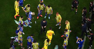 Hajime Moriyasu, Head Coach of Japan, speaks to players before extra time during the FIFA World Cup Qatar 2022 Round of 16 match between Japan and Croatia at Al Janoub Stadium on December 05, 2022 in Al Wakrah, Qatar.