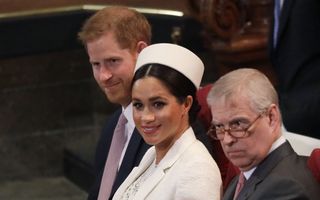 Meghan, Duchess of Sussex sits with Prince Harry, left, and Prince Andrew, right, during the Commonwealth Service at Westminster Abbey