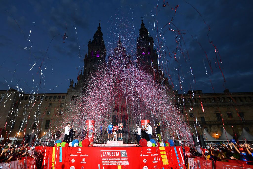 SANTIAGO DE COMPOSTELA SPAIN SEPTEMBER 05 A general view of Enric Mas Nicolau of Spain and Movistar Team Primoz Roglic of Slovenia and Team Jumbo Visma red leader jersey and Jack Haig of Australia and Team Bahrain Victorious celebrate winning on the podium ceremony in the Plaza del Obradoiro with the Cathedral in the background after during the 76th Tour of Spain 2021 Stage 21 a 338 km Individual Time Trial stage from Padrn to Santiago de Compostela lavuelta LaVuelta21 ITT on September 05 2021 in Santiago de Compostela Spain Photo by Stuart FranklinGetty Images