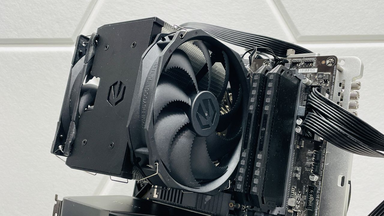 Endorfy Fortis 5 air cooler on a desk and loaded onto a motherboard.