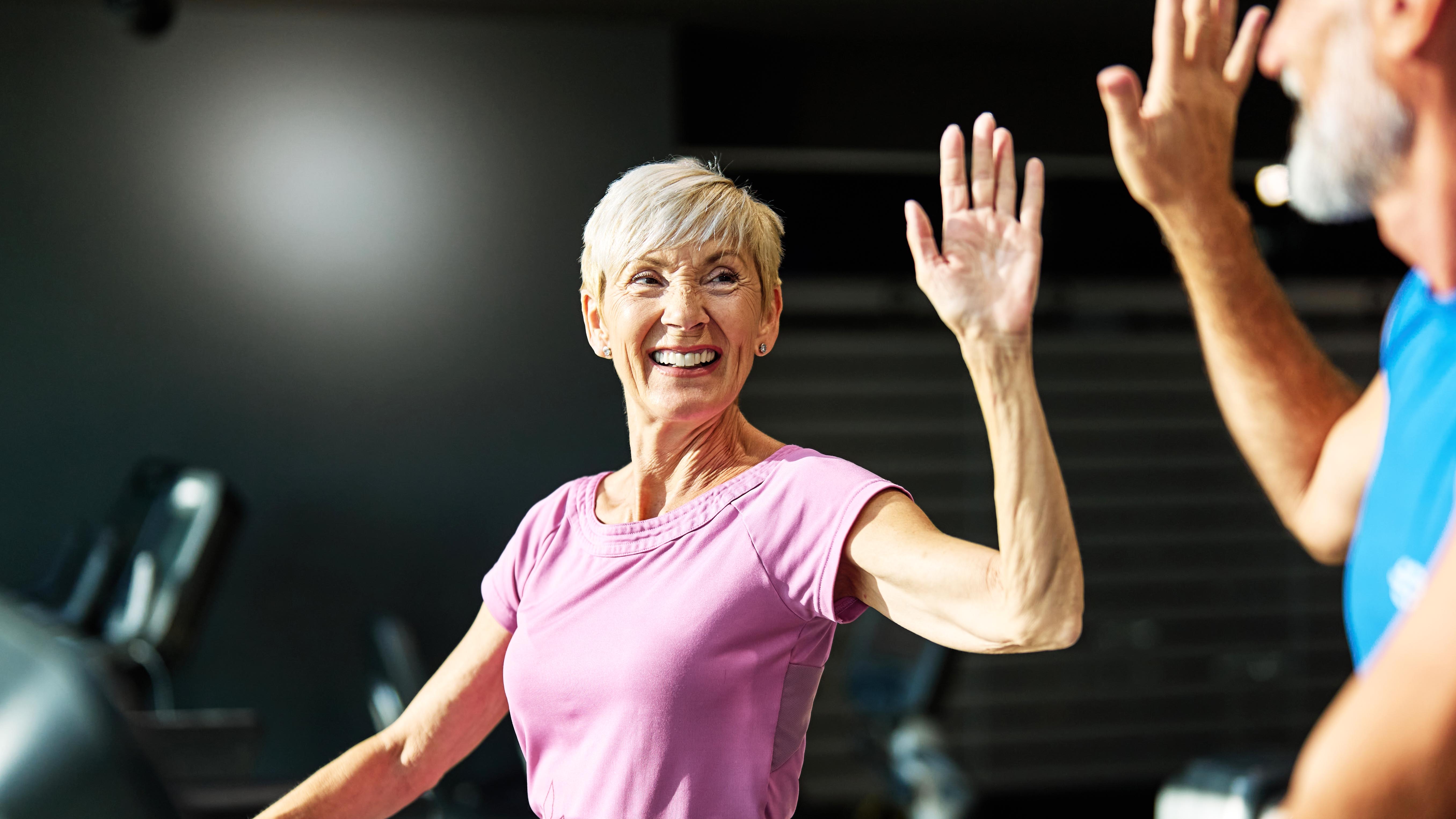 a senior woman exercising in the gym