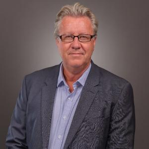 Headshot of Mark Coombes.