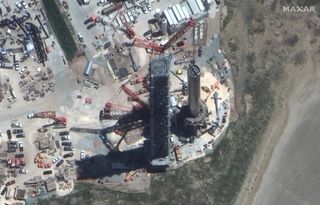 A closeup of the Starship Super Heavy known as Booster 4 on the orbital launch mount at SpaceX's Starbase site in South Texas. Photo captured on Aug. 9, 2021, by Maxar Technologies' WorldView-3 satellite.